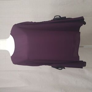 Purple Blouse featuring stylish keyhole cutouts in the sleeves